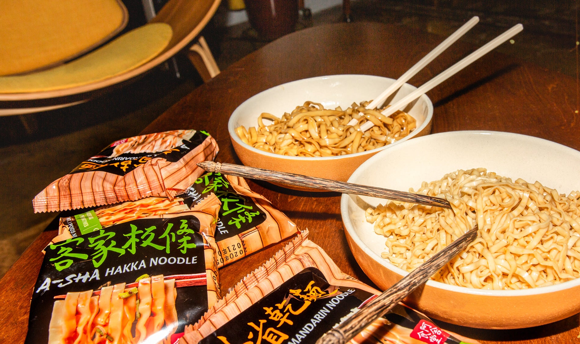 A-Sha noodles and sauce packets served at a table